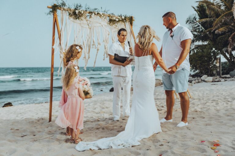 Symbolic ceremony on the sand beneath a macramé arch, with a flower girl, Better Together Mexico