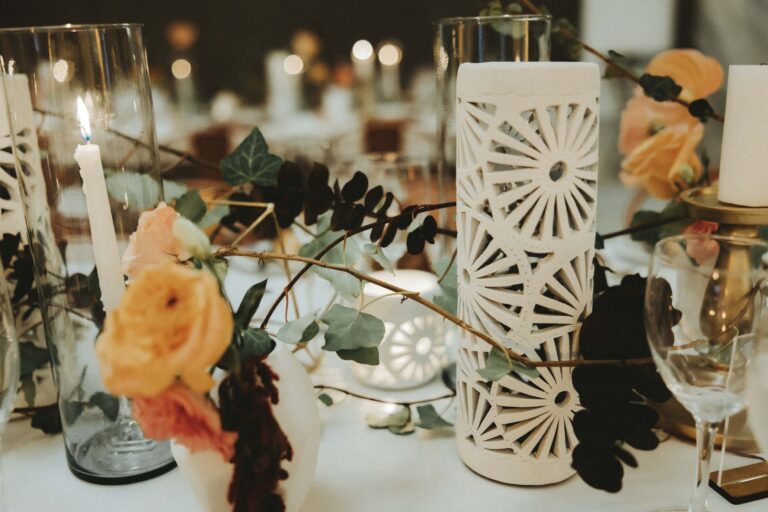 Table detail with carved candle holders, orange roses and foliage, Better Together Mexico