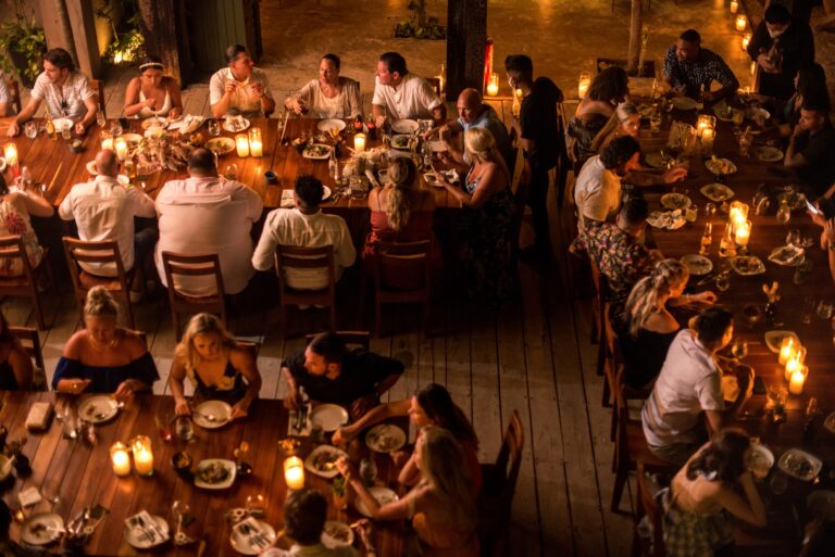 Candlelit wedding dinner for a long table of guests, seen from above, Better Together Mexico