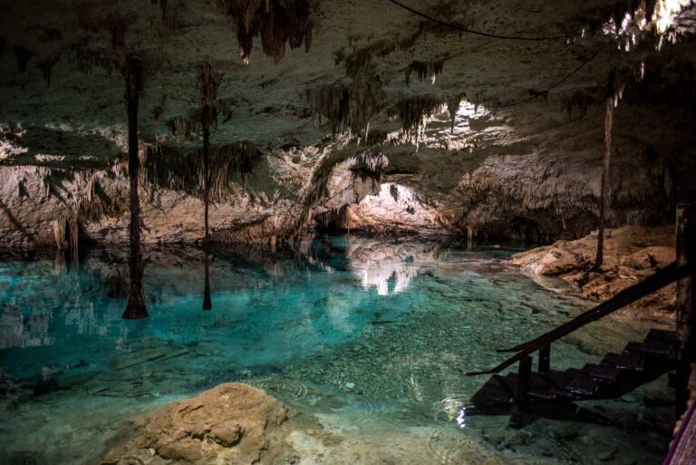A turquoise cenote with stalactites, used as a ceremony setting in Riviera Maya, Better Together Mexico