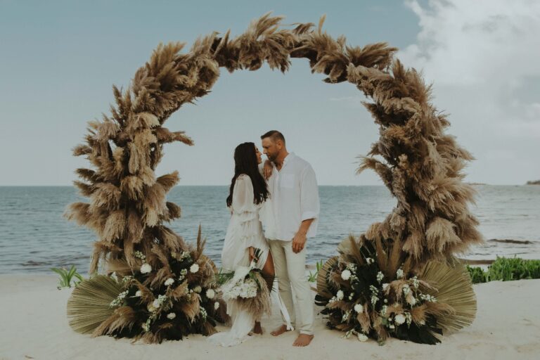 A circular pampas grass and floral arch on the beach for a couple portrait, Better Together Mexico