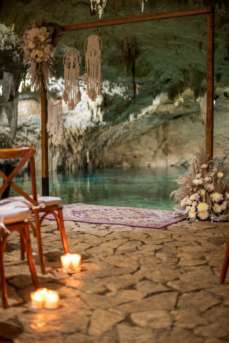 Cenote ceremony set-up with macramé, candles and chairs by the water, Better Together Mexico