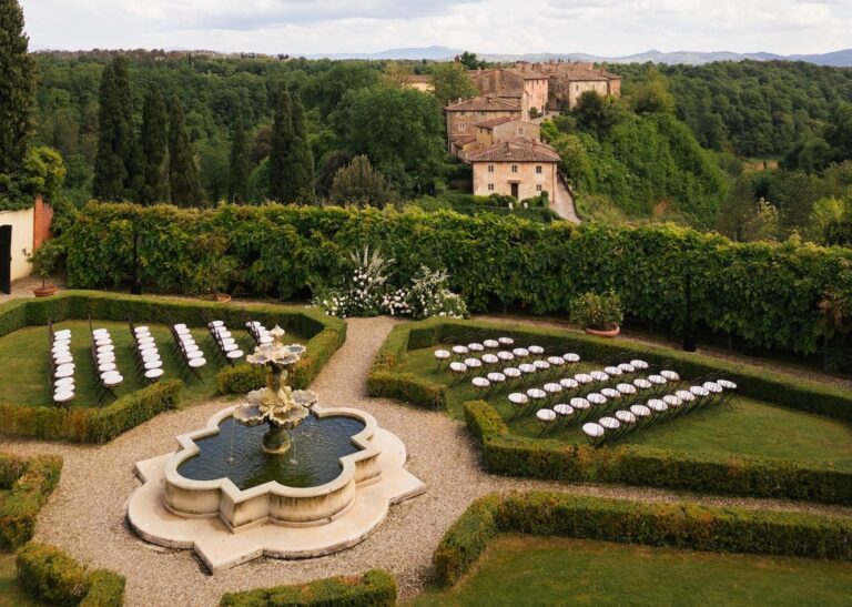 From the air: the parterre, chairs in rows either side of the fountain, the borgo above, Bianco Bouquet Weddings and Events