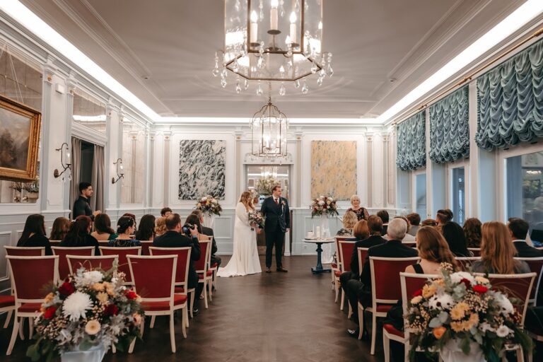 Ceremony room set with red chairs and guests, Chateau Gutsch, Lucerne, Bilingual Celebrant in Europe
