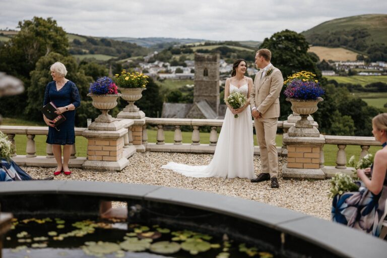 Terrace ceremony with the celebrant beside the couple, Bilingual Celebrant in Europe