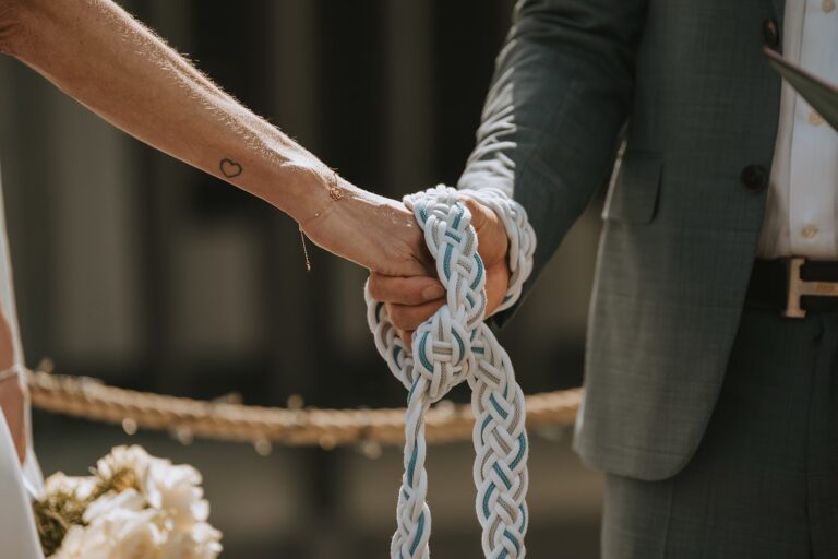 Handfasting cord tied around the couple's hands, Bilingual Celebrant in Europe
