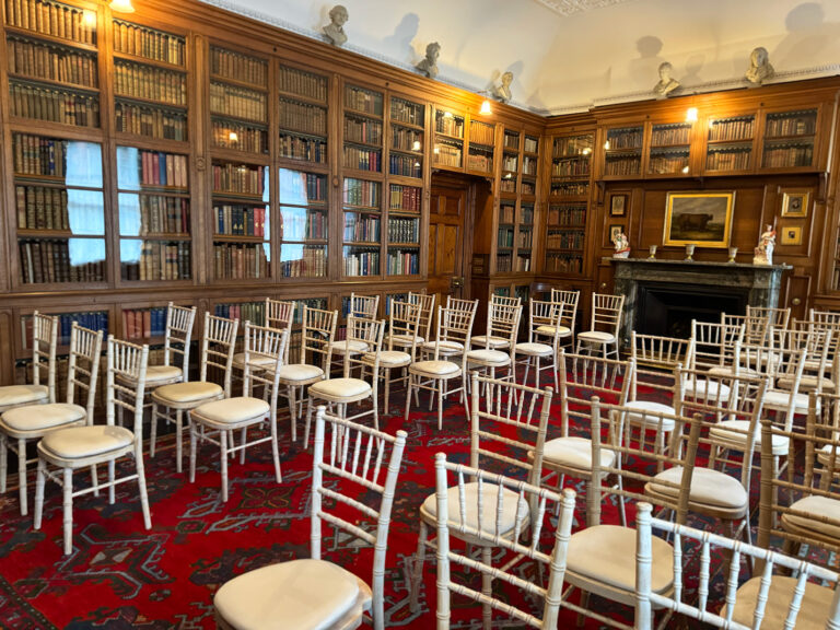 The Library with gilt chairs set in rows between the bookcases, Blair Castle
