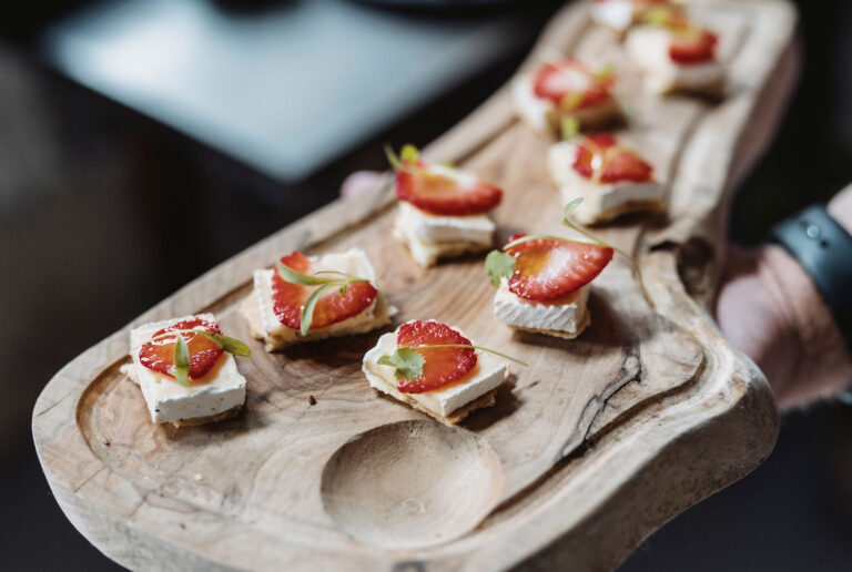Canapes with strawberries served on a carved wooden board, Blair Castle