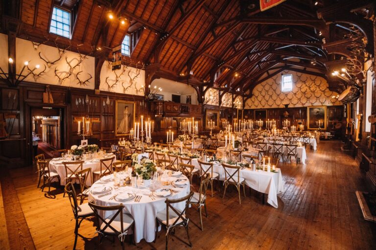 The Ballroom set with round tables and candles for a wedding dinner, Blair Castle