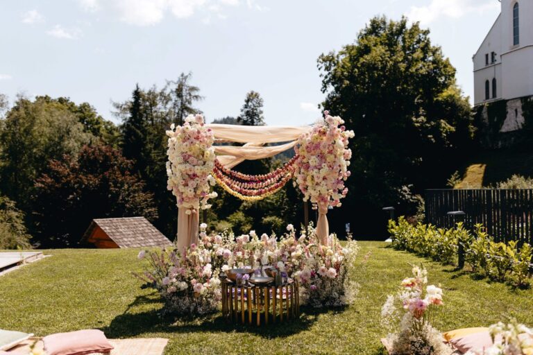 Floral ceremony arch on the lawn, Bled Rose Hotel