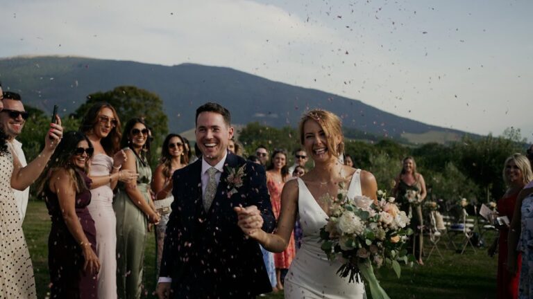 Alice and Dale under confetti with the hills behind at Castello di Petrata, Assisi (frame from their film), Blue Ridge Films