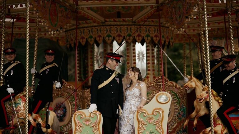 Megan and James on a vintage carousel at their fairground wedding at Hengrave Hall, Suffolk (frame from their film), Blue Ridge Films