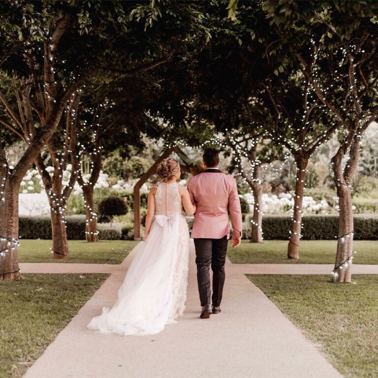 Couple walking the aisle on the Garden and Treed Terrace, Bona Dea Private Estate