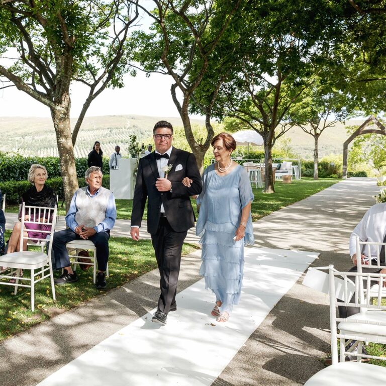 Guests arriving along the garden aisle, Bona Dea Private Estate