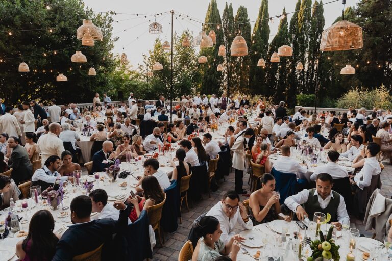 Dinner on the terrace under strings of lights, Borgo Bucciano