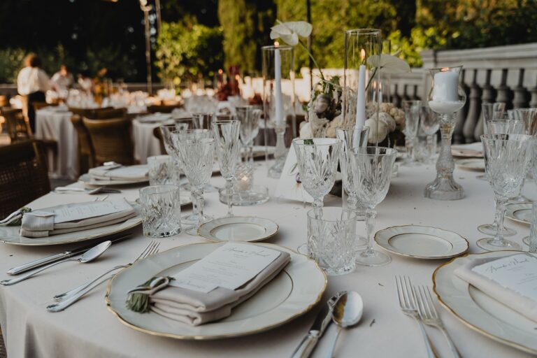 Table setting with glassware and gilt-edged plates, Borgo Bucciano