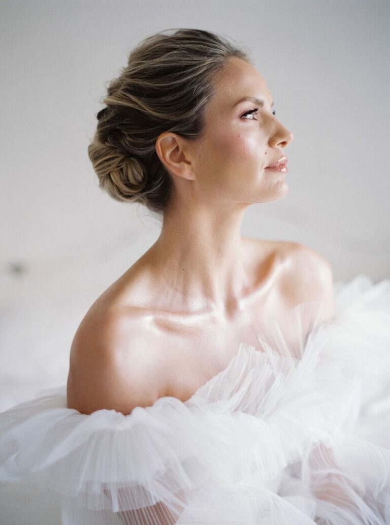 A low, unfussed chignon, styled for a Beach House wedding, Botias
