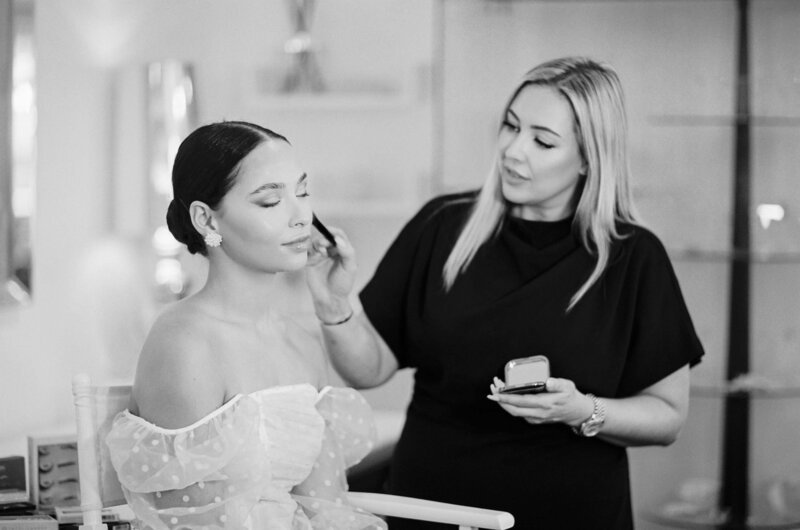 The team at work: a final touch of blush before the veil goes on, Botias