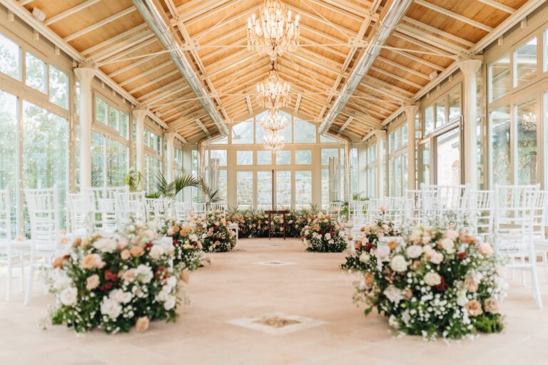 Glass-roofed pavilion set for a ceremony, with flowers along the aisle, Bottega dei Fiori by Ezio De Angelis