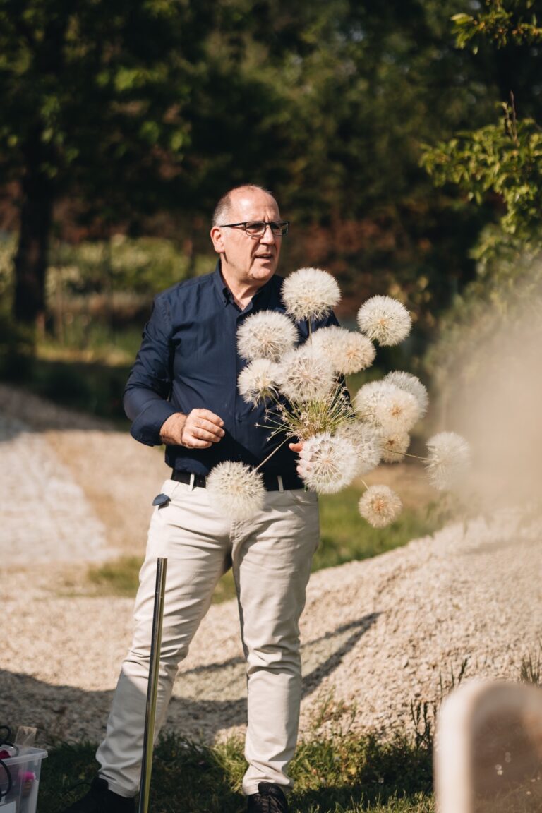 Ezio De Angelis with dried allium seed heads, Bottega dei fiori