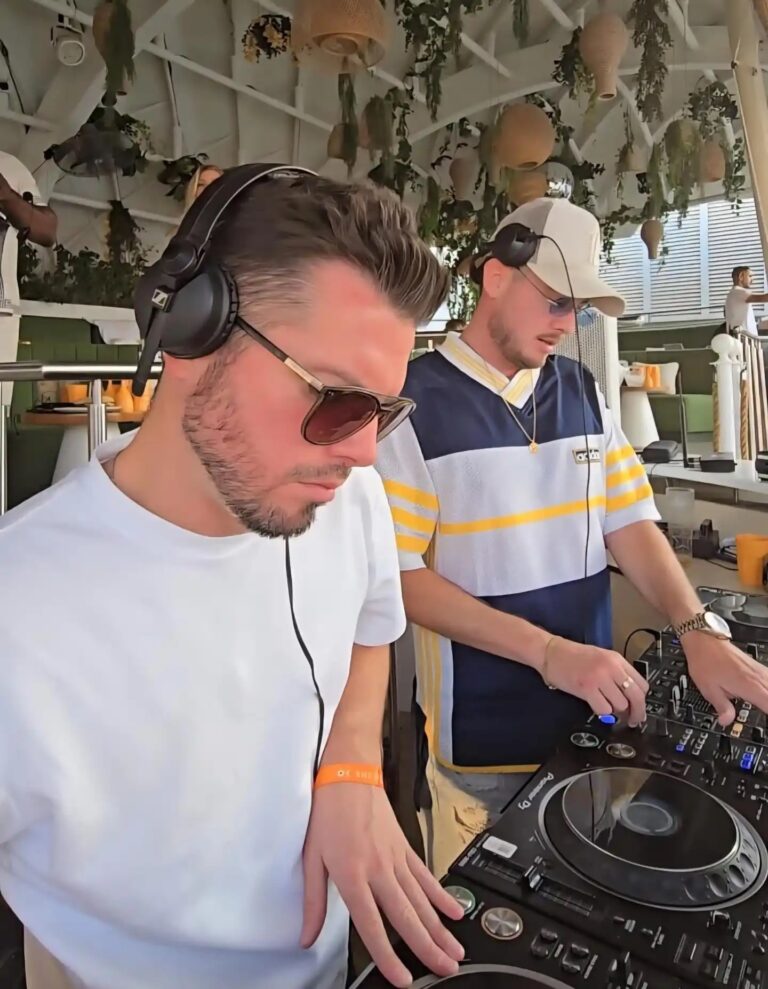Two DJs share the decks on a terrace, Box Entertainment