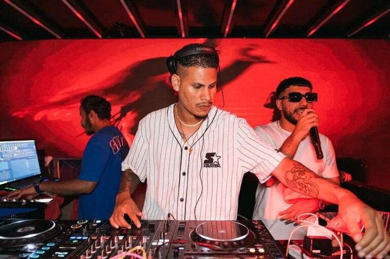 A DJ and an MC working a set under red lighting, Box Entertainment
