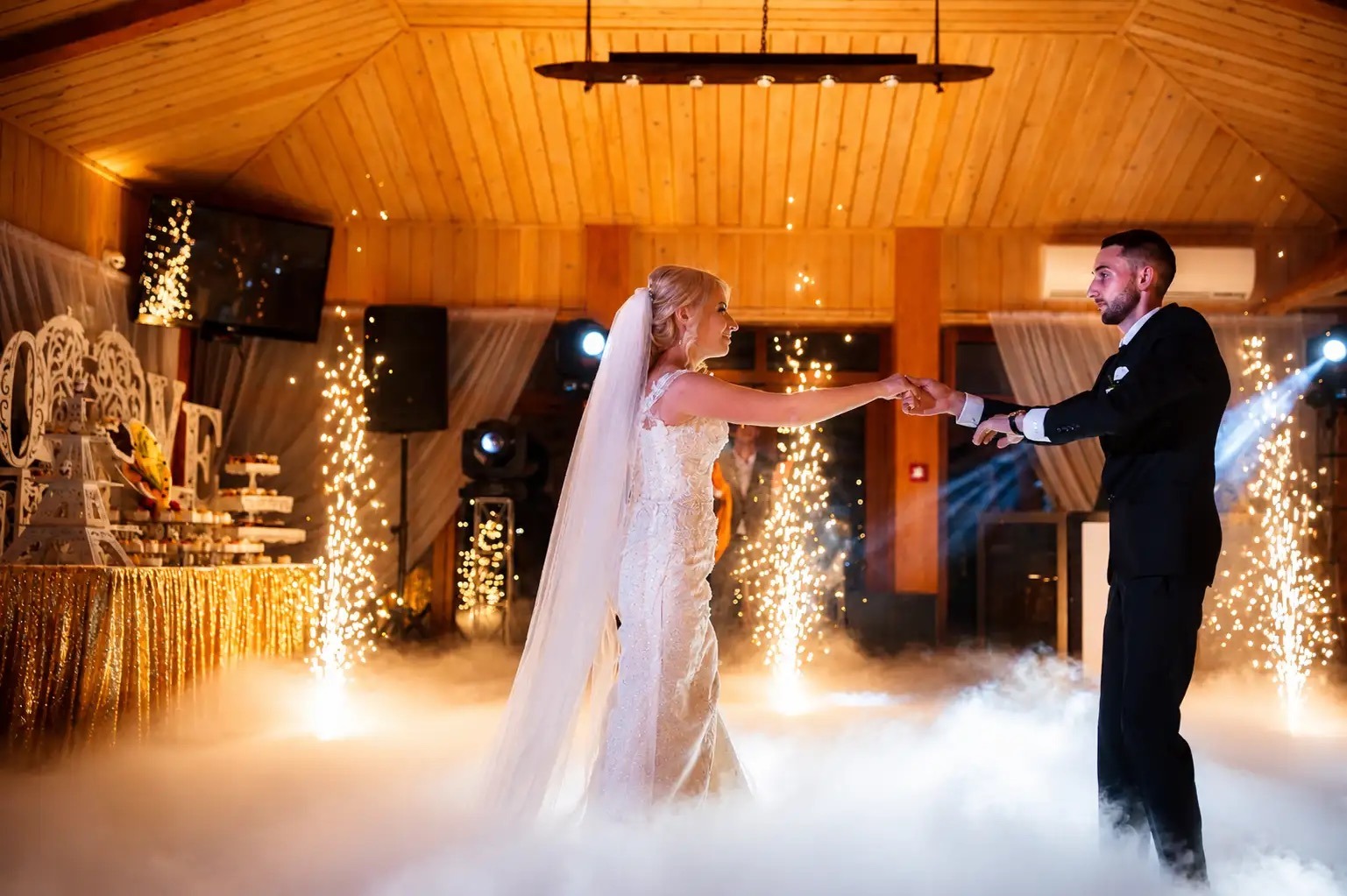 A couple share their first dance as cold spark fountains and low dry ice surround them, Box Entertainment
