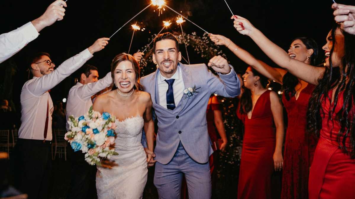 Guests hold sparklers to form an aisle as the newly married couple walk through, Box Entertainment