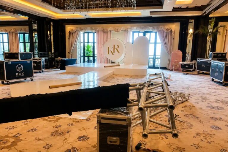 Staging and flight cases being set up in a ballroom before an event, Box Entertainment
