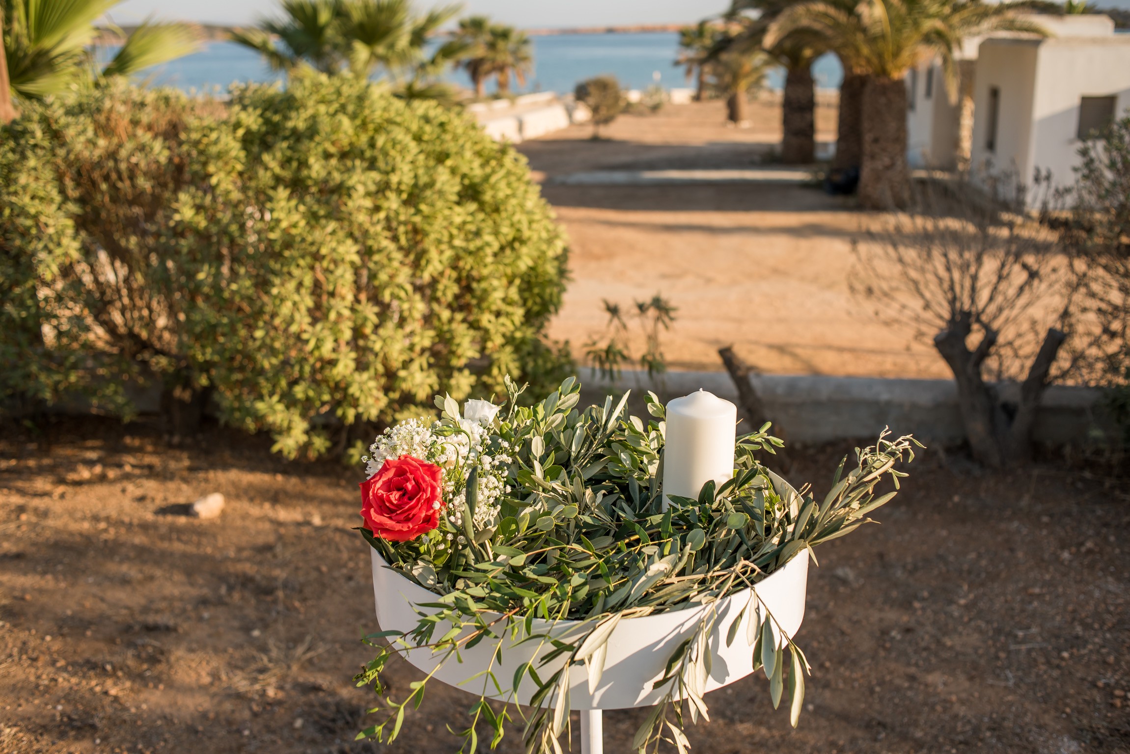 Bridal flower arrangement in a white planter with olive branches, Paros, Bright Blue Wedding And Events