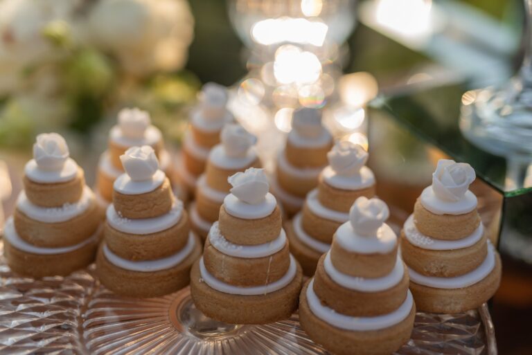 Mini wedding-cake pastries on a glass stand, Bright Blue Wedding And Events