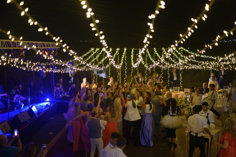 Reception under strings of lights at night, Bright Blue Wedding And Events