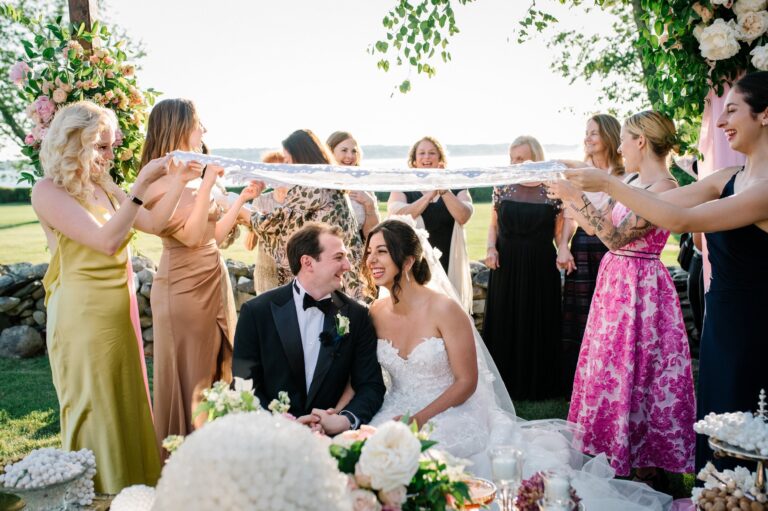 Couple seated under a veil held by the bridal party, Newport, Brilliant Event Planning