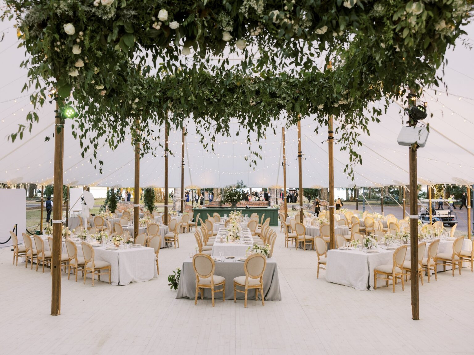 A tented dinner under a hanging greenery canopy at Palmetto Bluff, South Carolina