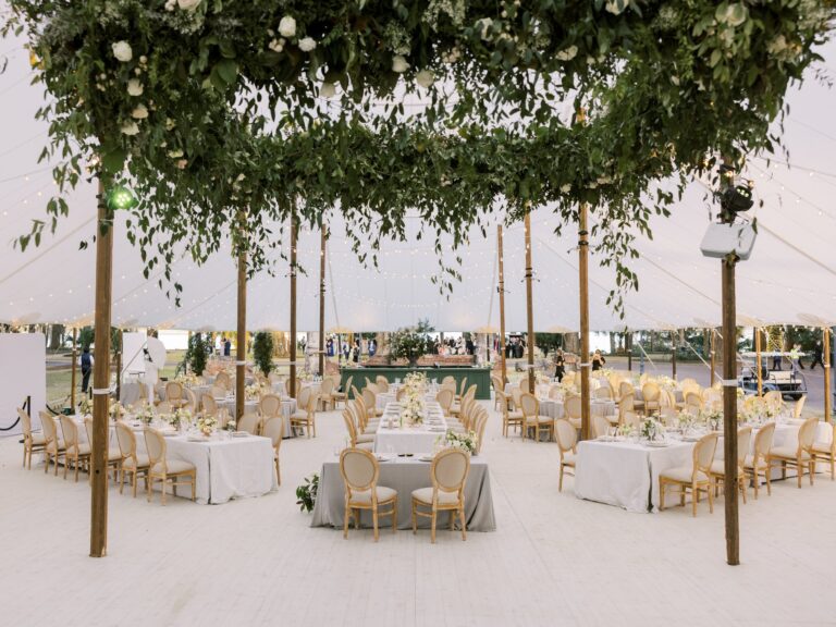Tented dinner under a hanging greenery canopy, Palmetto Bluff, Brilliant Event Planning