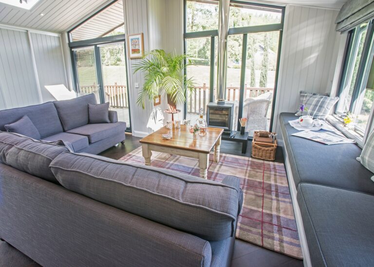 The Retreat's living space, sofas facing the garden windows, Broadoaks Country House
