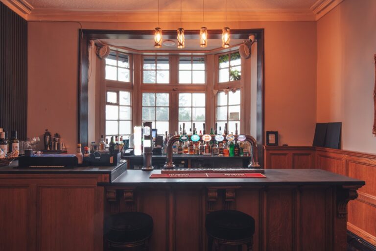 Figgy's Bar, a dark timber counter under the bay window, Broadoaks Country House