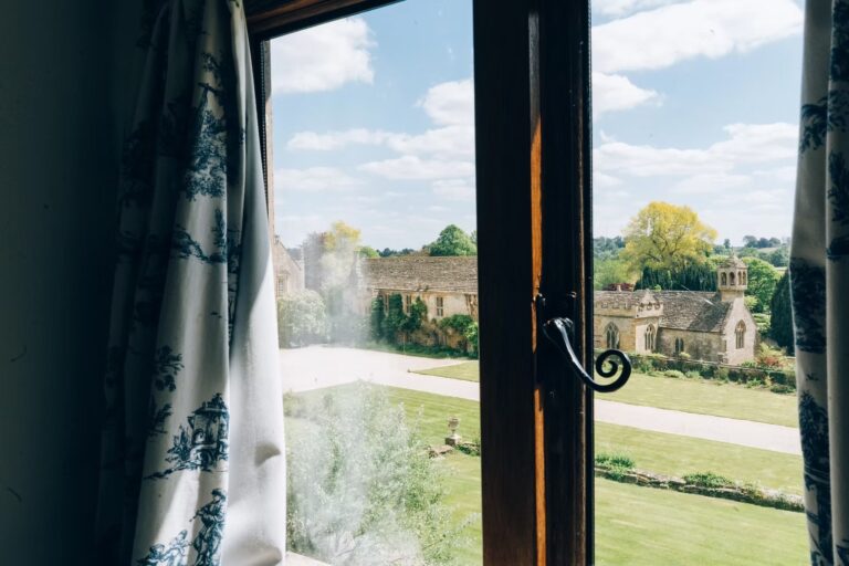 The view from a bedroom window across the lawn to St Andrew's Church, Brympton House