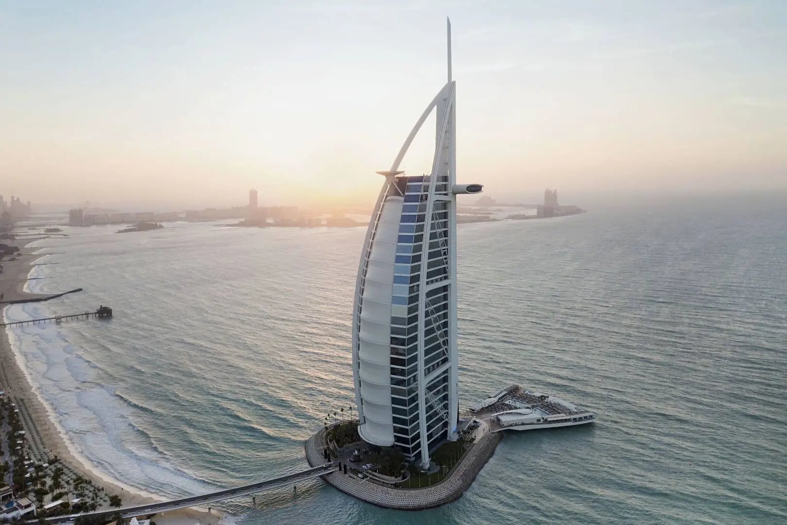 Aerial view of the hotel and its causeway at sunset, Burj Al Arab Jumeirah