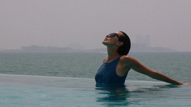 Swimmer in the infinity pool above the Gulf, Burj Al Arab Jumeirah