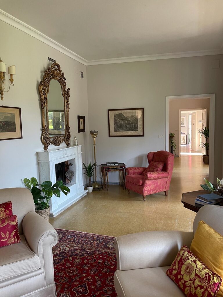 A villa sitting room, with its fireplace, Burlamacchi Villas