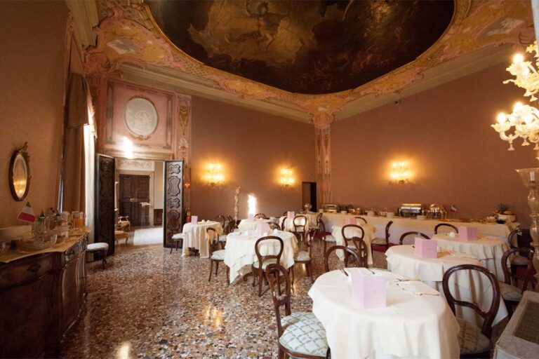 The Doge Hall, an ornate salon set for dining beneath a frescoed ceiling, Ca' Sagredo Hotel