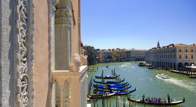 The view from a Gothic balcony over the Grand Canal and the gondolas below, Ca' Sagredo Hotel