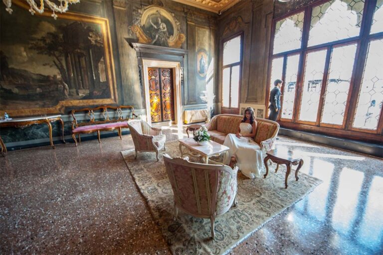 A salon of sofas and paintings, Gothic windows onto the canal, Ca' Sagredo Hotel