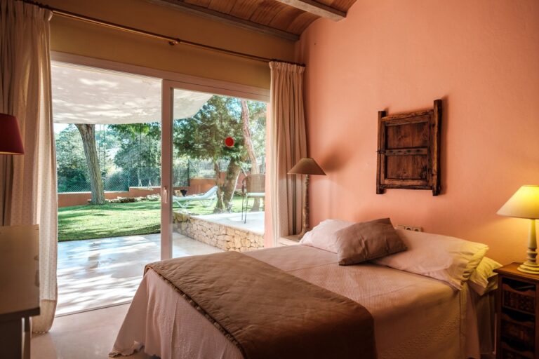 A bedroom opening to the garden, Can Lluc Hotel