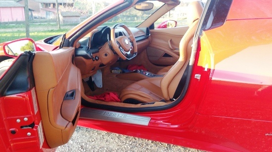 Red Ferrari 458 Spider with tan leather interior and door open, Canestri Autonoleggi, Car Hire Italy