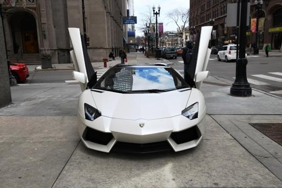 White Lamborghini Aventador Roadster with scissor doors raised, Canestri Autonoleggi, Car Hire Italy