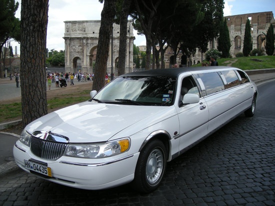White limousine with black roof near the Arch of Constantine, Rome, Canestri Autonoleggi, Car Hire Italy