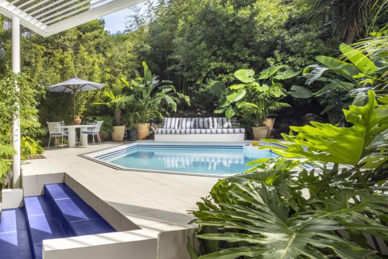 Garden pool with steps and tropical planting, Capri Palace Jumeirah