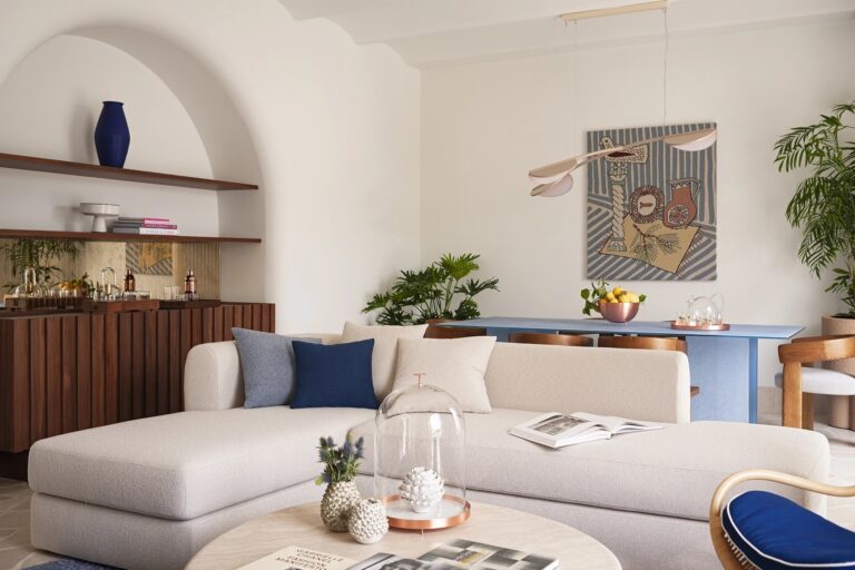 Suite lounge with white sofa and blue accents, Capri Palace Jumeirah